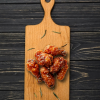 Frozen chicken roasted spicy drumlets,ready to cook, with a rich reddish glaze and crispy finish