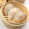 Turnip dumpling (soon kueh) showcasing their translucent skin and crescent shape, ready to be steamed and enjoyed
