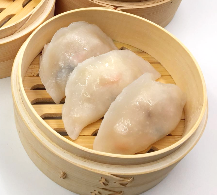 Turnip dumpling (soon kueh) showcasing their translucent skin and crescent shape, ready to be steamed and enjoyed