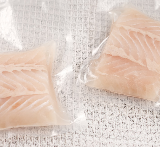 Frozen Hoki portion fish with moist, flaky white flesh—ideal for healthy and easy meals