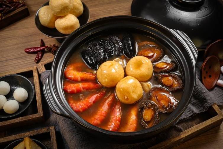 Delicious fish curd served in traditional pen cai