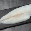 Frozen flounder fillet with flaky flesh and a slightly firm texture, perfectly preserved for freshness