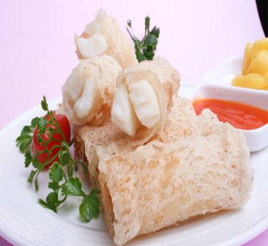 Frozen scallop roll wrapped in rice paper, showcasing a delicate presentation